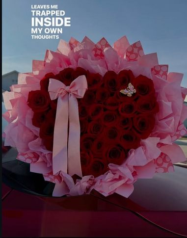 Floral arrangement with Dior gift bag