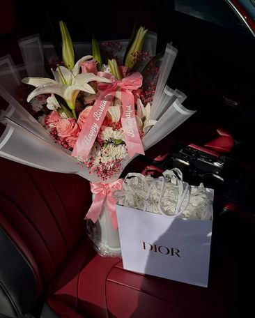 Rose bouquet detail in pink wrap